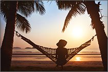 Lady in a hammock looking at the water