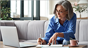 Older woman working on laptop