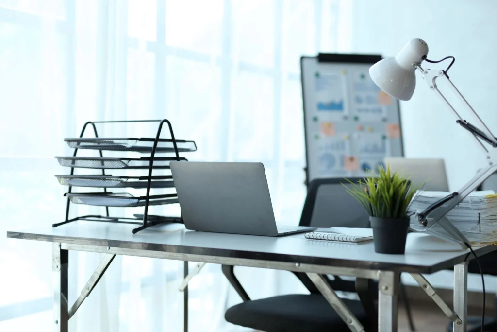 Desk with laptop and lamp